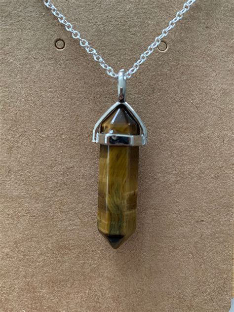 Step into the World of Practical Magic with a Tiger Eye Crystal Necklace